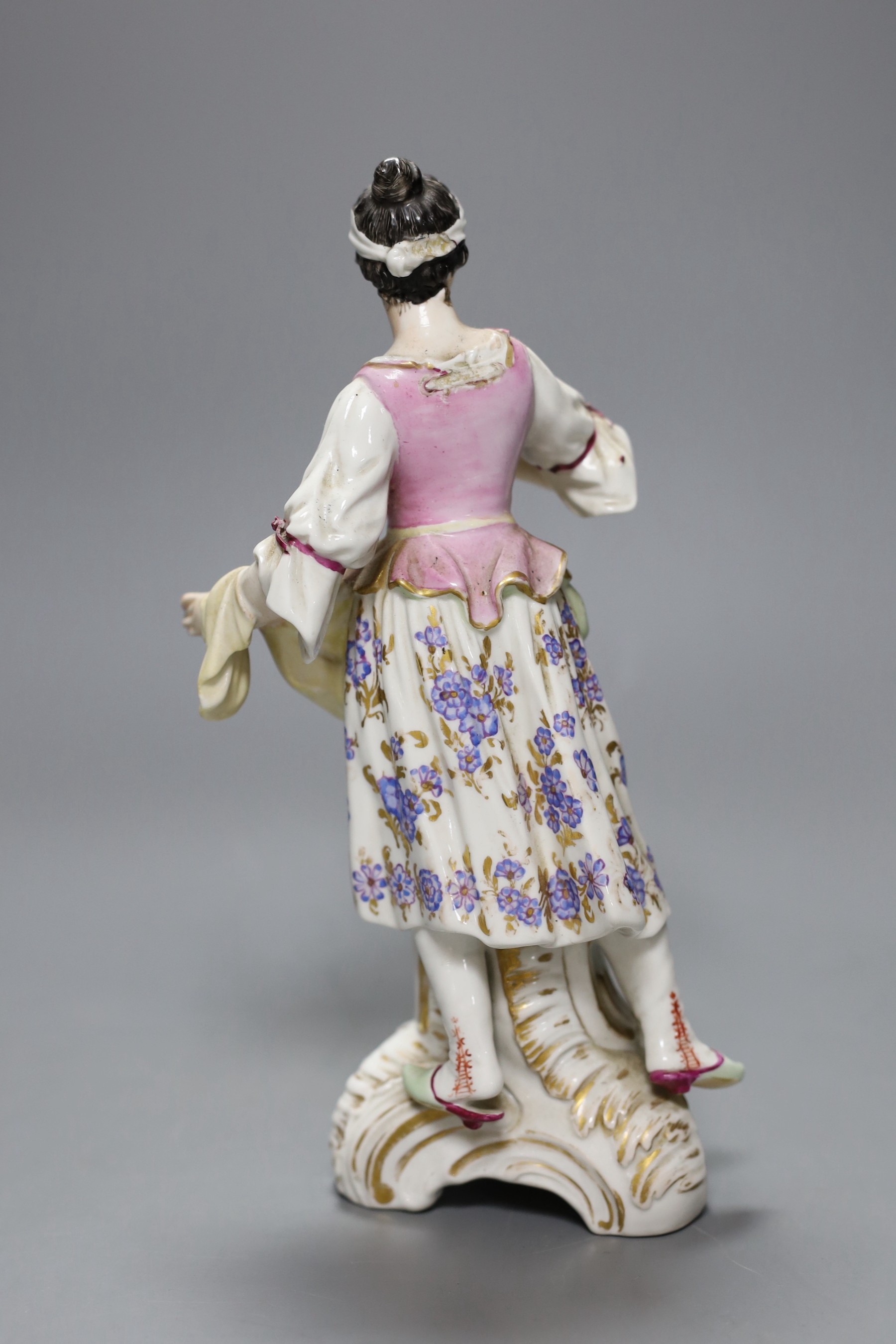 A Berlin porcelain figure of a fruit carrier, 22cm